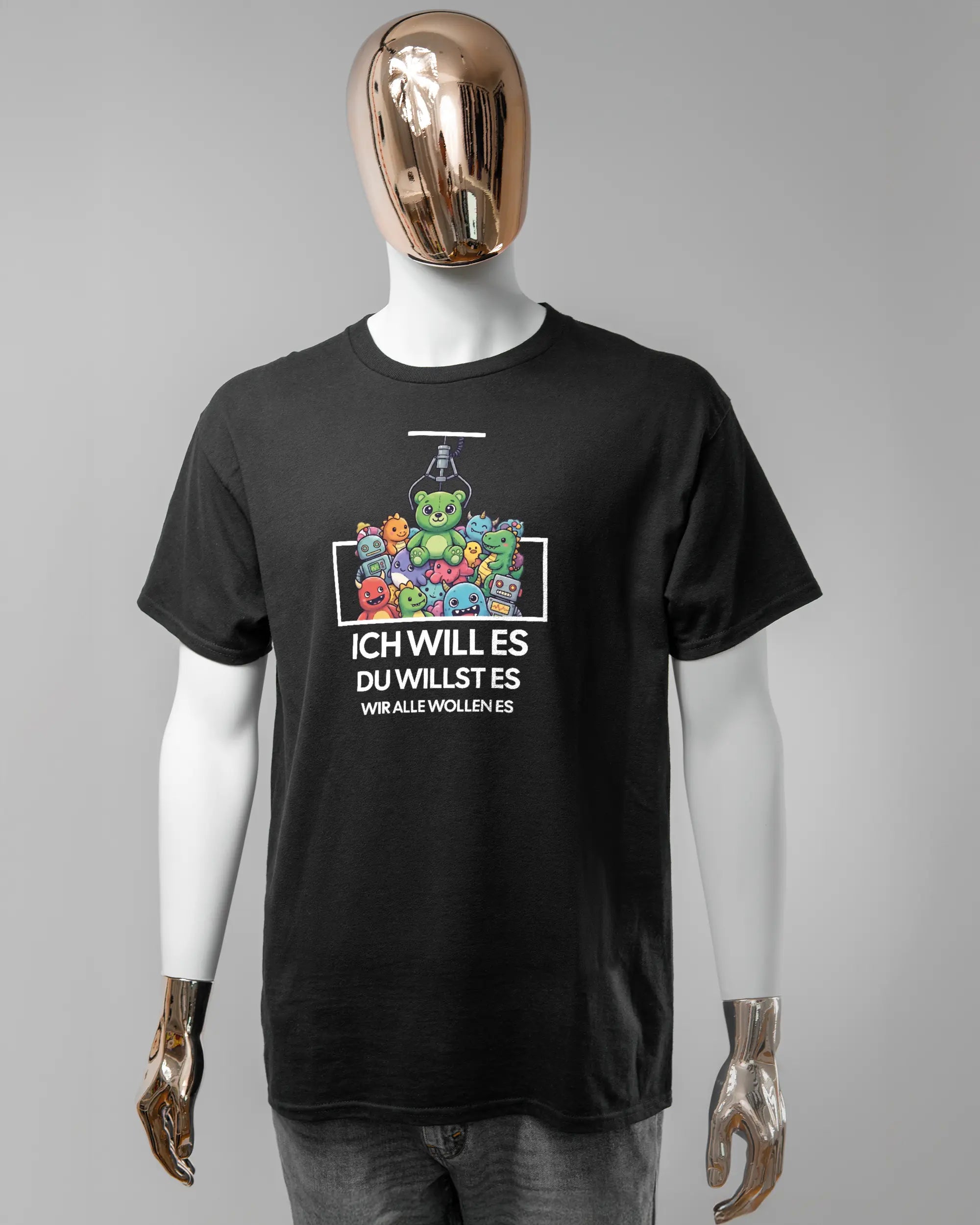 Vorderseite des Basic Unisex T-Shirt Regular von Maondo mit dem Design Will Stofftier in der Farbe Black und in der Größe L getragen von einer maskulinen Puppe