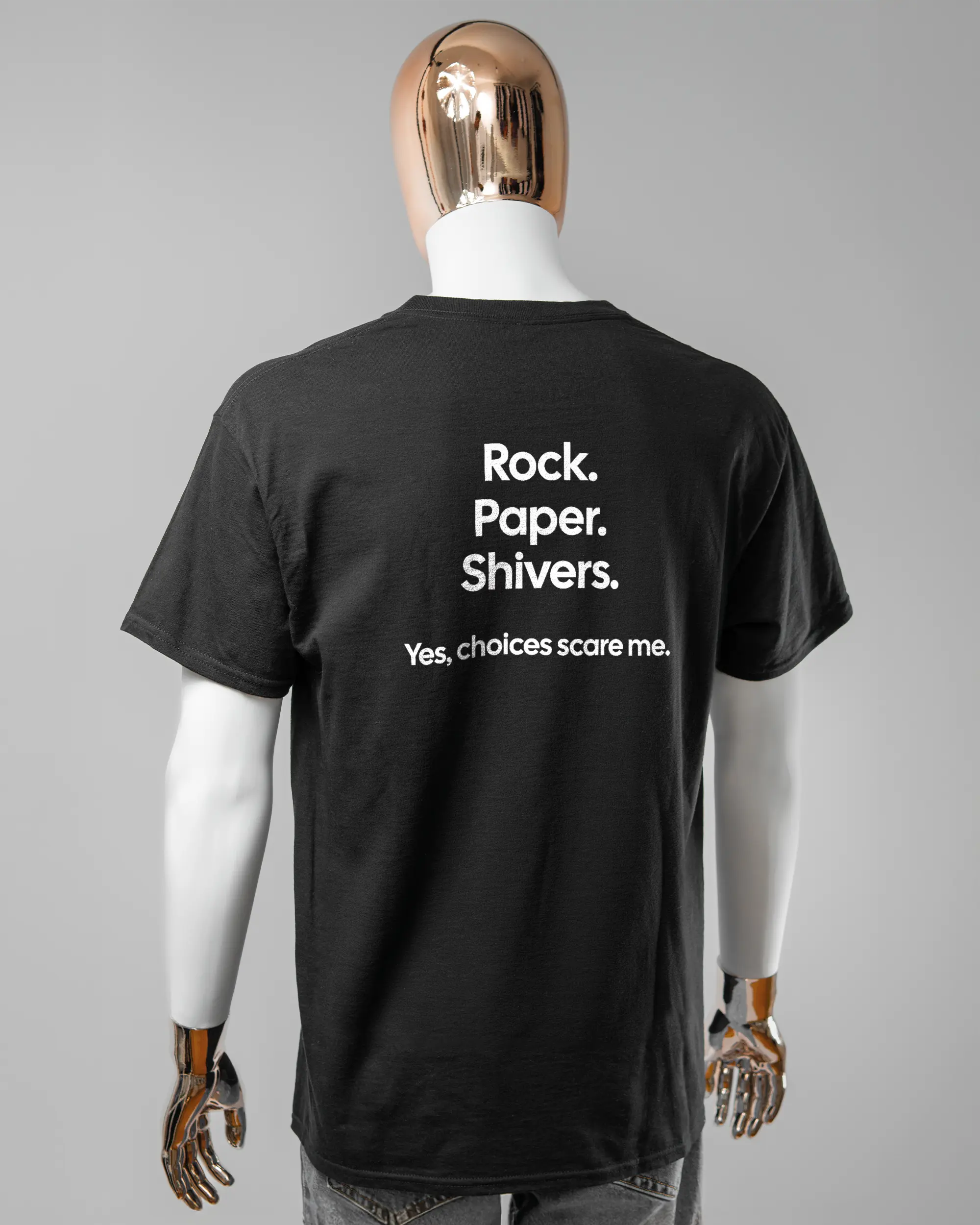 Rückseite des Basic Unisex T-Shirt Regular von Maondo mit dem Design Rock Paper Shivers in der Farbe Black und in der Größe L getragen von einer maskulinen Puppe