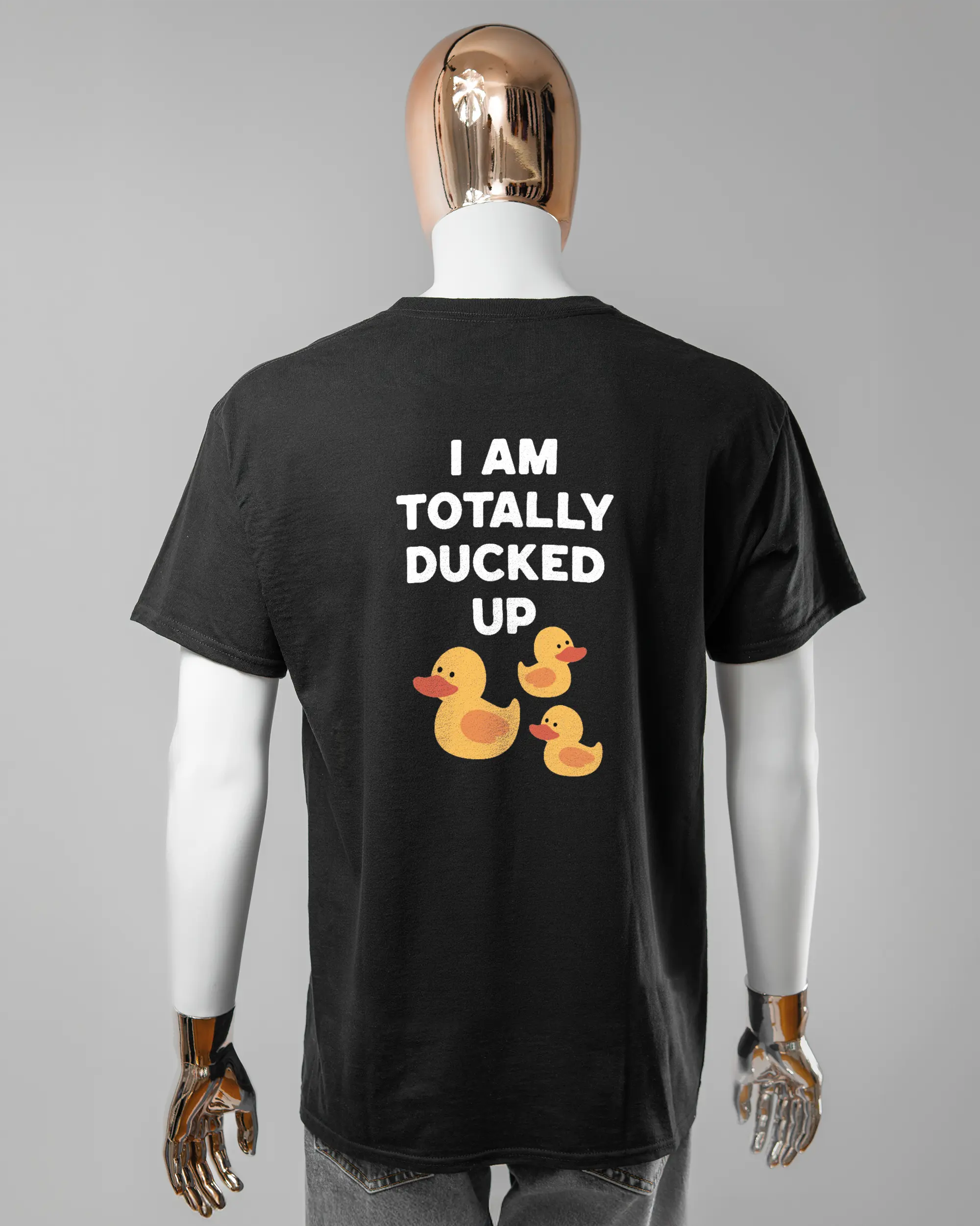 Rückseite des Basic Unisex T-Shirt Regular von Maondo mit dem Design Ducked Up in der Farbe Black und in der Größe L getragen von einer maskulinen Puppe