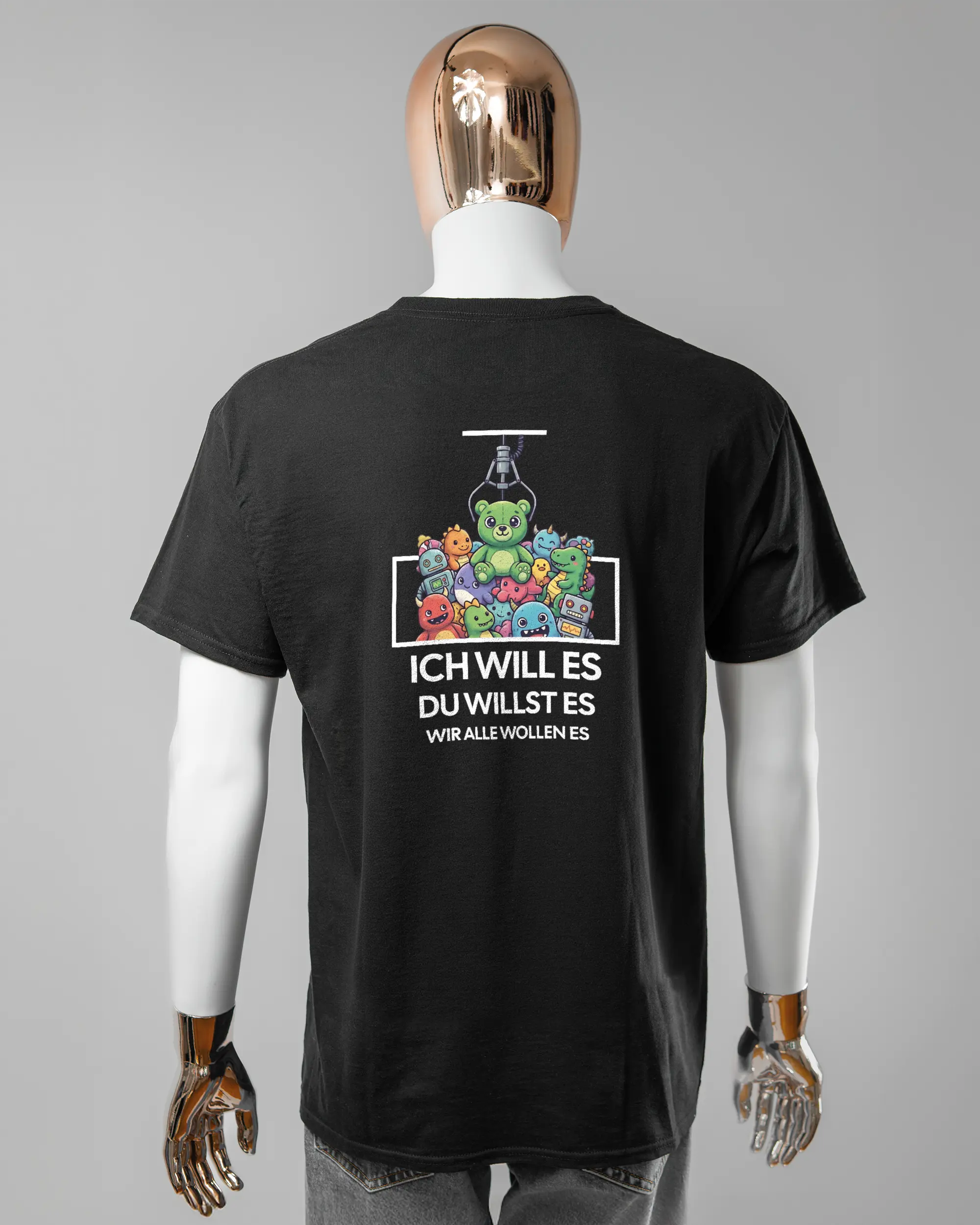 Rückseite des Basic Unisex T-Shirt Regular von Maondo mit dem Design Will Stofftier in der Farbe Black und in der Größe L getragen von einer maskulinen Puppe