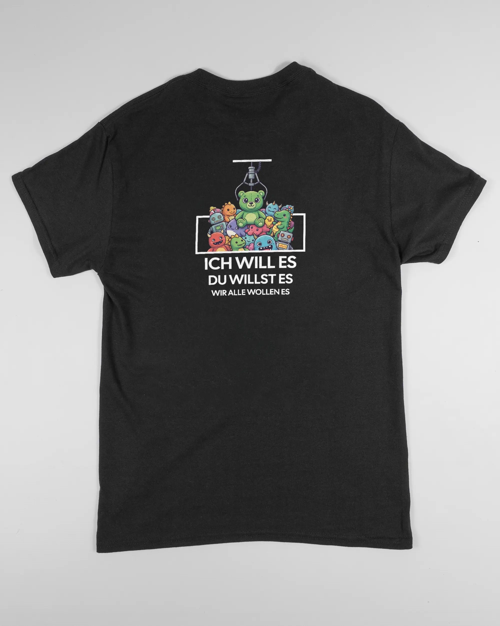 Rückseite des Basic Unisex T-Shirt Regular von Maondo mit dem Design Will Stofftier in der Farbe Black und in der Größe S flach auf den Boden gelegt