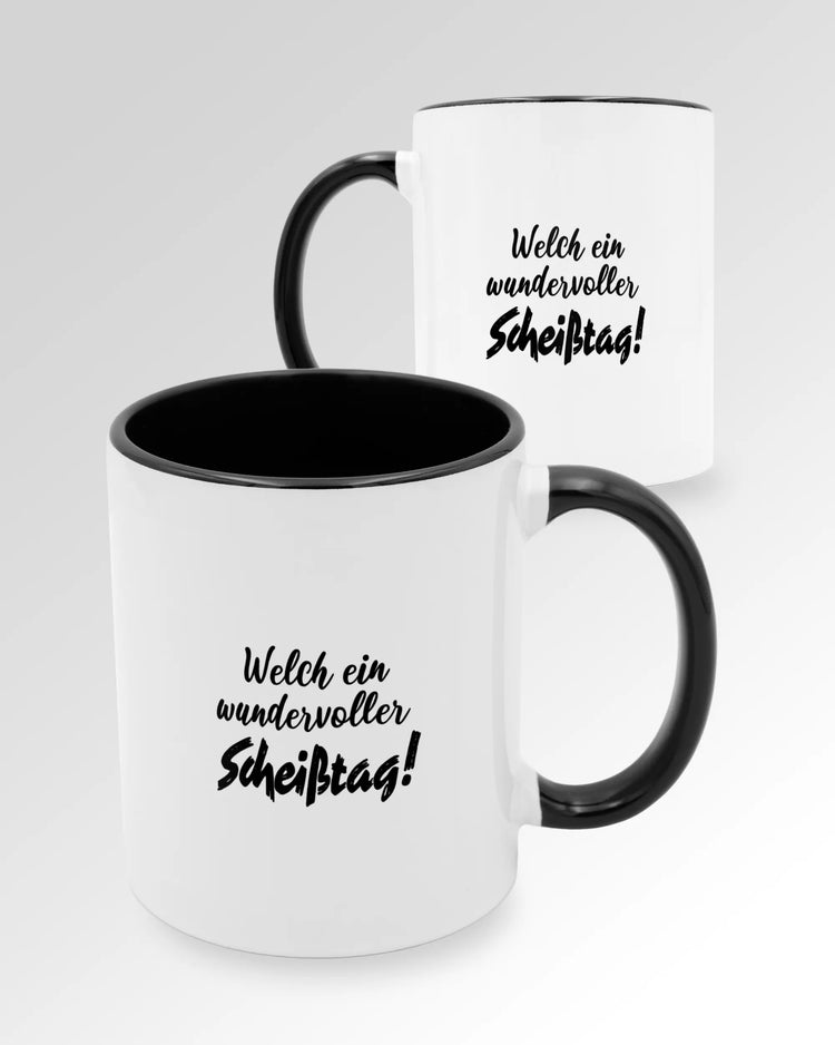Variantenbild der beidseitig bedruckten Keramik Tasse von Maondo mit dem Design Wundervoller Scheißtag in der Farbe Schwarz-Weiß