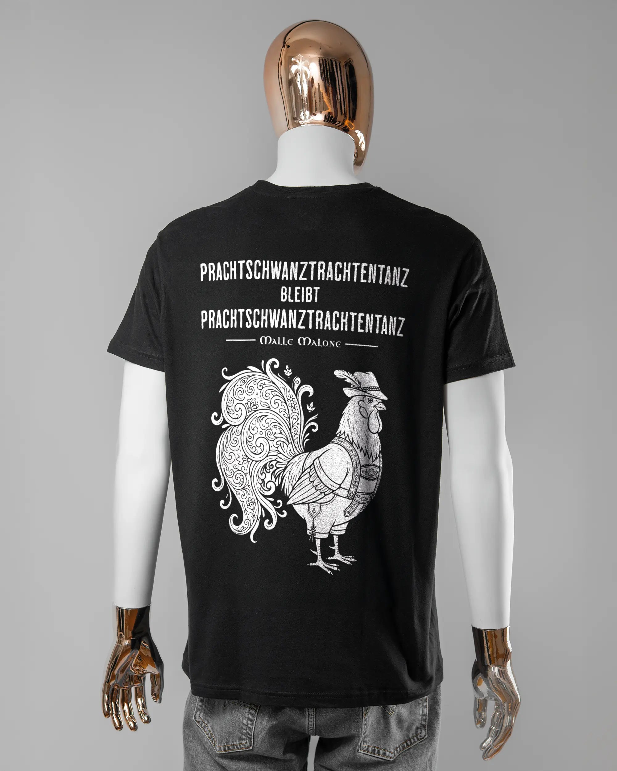 Rückseite des Basic Unisex T-Shirt Soft von Maondo mit dem Design Trachtentanz in der Farbe Black und in der Größe L getragen von einer maskulinen Puppe
