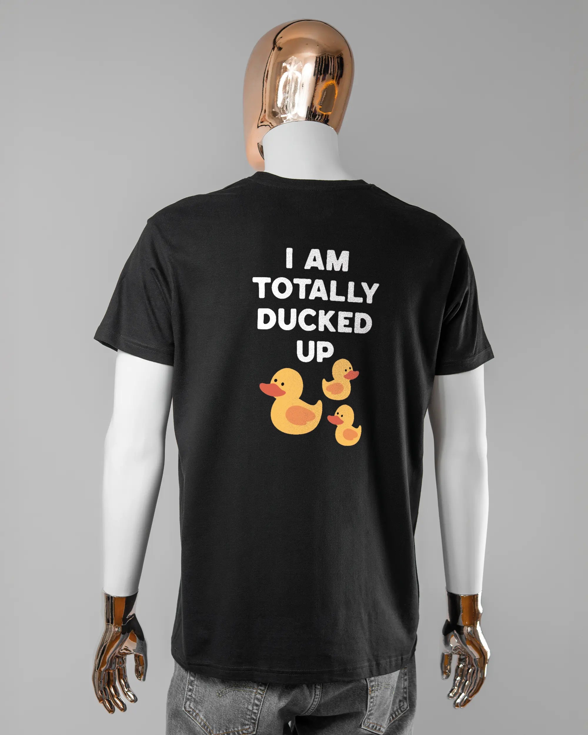 Rückseite des Basic Unisex T-Shirt Soft von Maondo mit dem Design Ducked Up in der Farbe Black und in der Größe L getragen von einer maskulinen Puppe