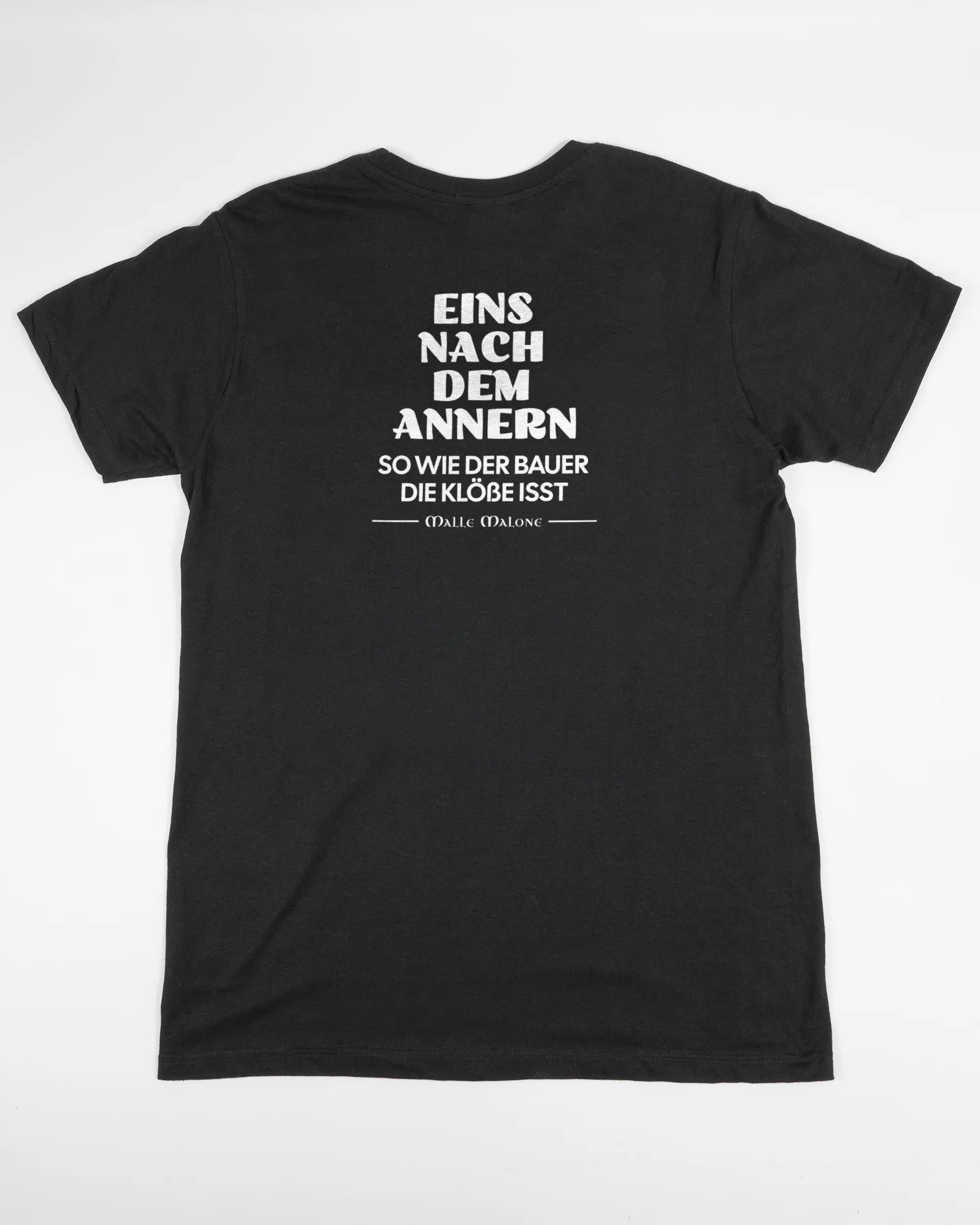 Rückseite des Basic Unisex T-Shirt Soft von Maondo mit dem Design Eins nach dem Annern in der Farbe Black und in der Größe S flach auf den Boden gelegt