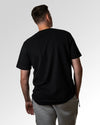 Primärer Modelshot der unbedruckten Seite des Organic Unisex T-Shirts von Maondo im Heavy Fit mit dem Design Ein Brett geben in der Farbe Black