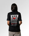 Weiblicher Modelshot der sekundären Druckseite des Organic Unisex T-Shirts von Maondo im Relaxed Fit mit dem Design Authentic Shit in der Farbe Black