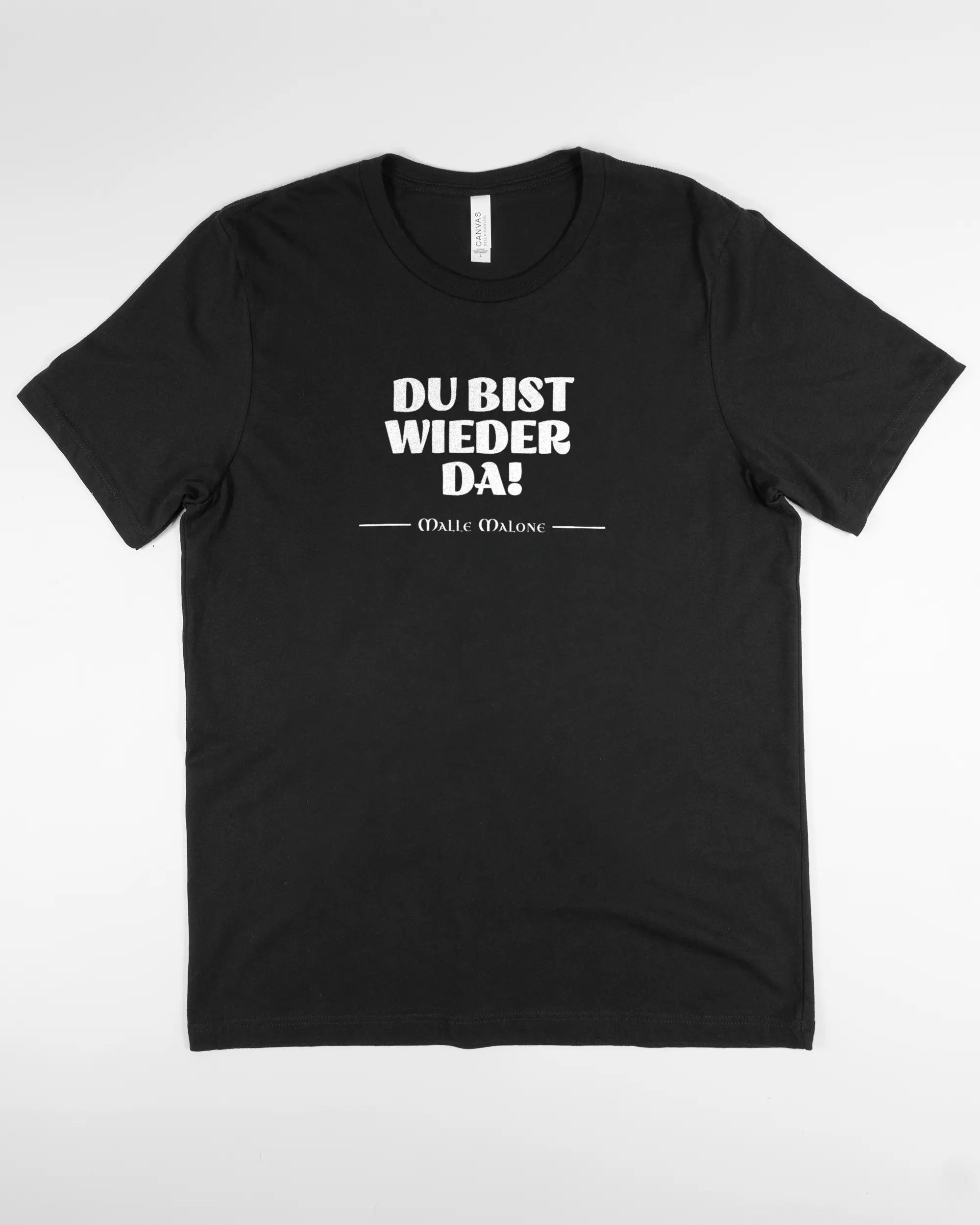 Vorderseite des Basic Unisex T-Shirt Light von Maondo mit dem Design Wieder da in der Farbe Black und in der Größe L flach auf den Boden gelegt