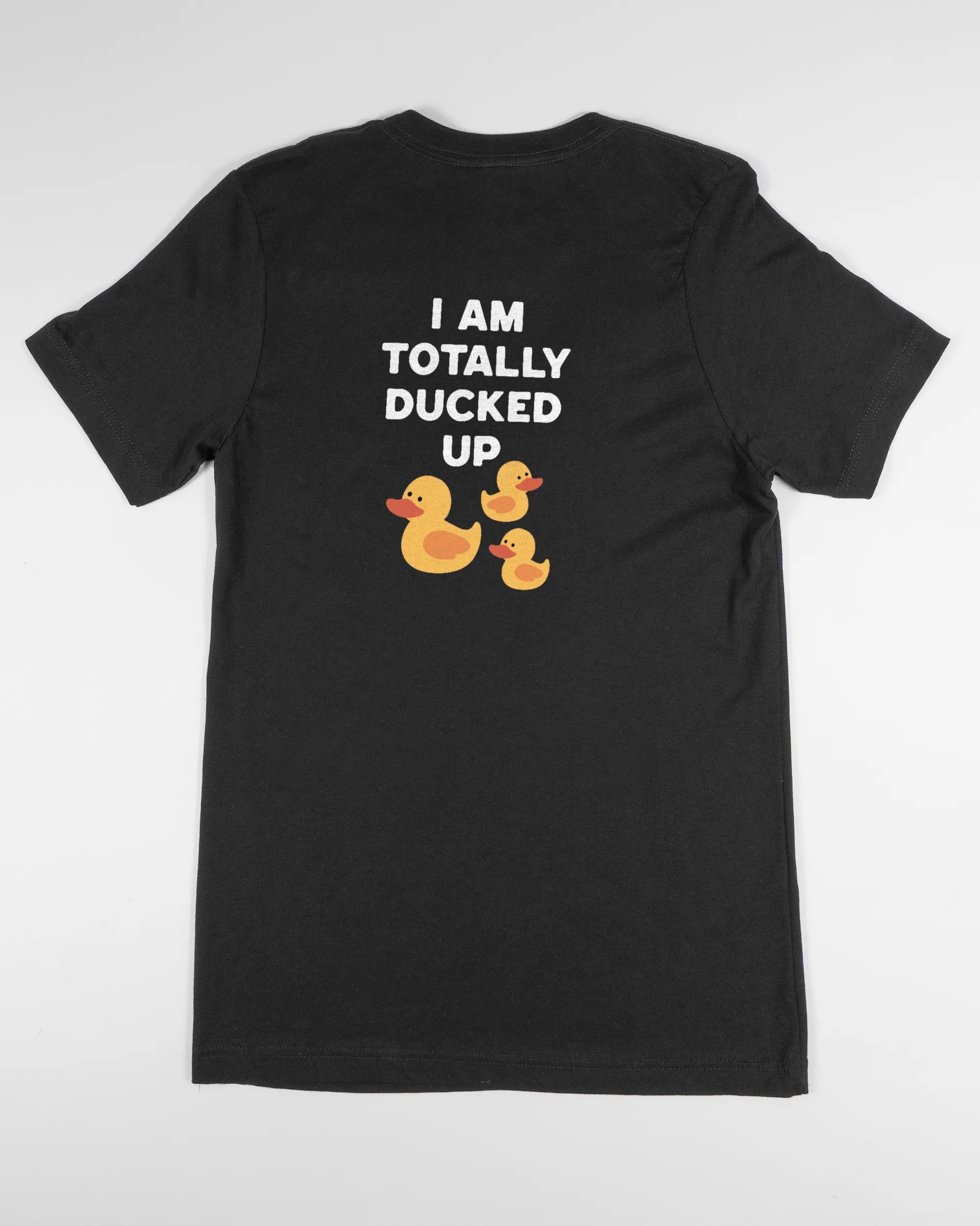 Rückseite des Basic Unisex T-Shirt Light von Maondo mit dem Design Ducked Up in der Farbe Black und in der Größe S flach auf den Boden gelegt