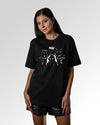 Sekundärer Modelshot der Druckseite des Organic Unisex T-Shirts von Maondo im Oversized Fit mit dem Design Miau Gang in der Farbe Black