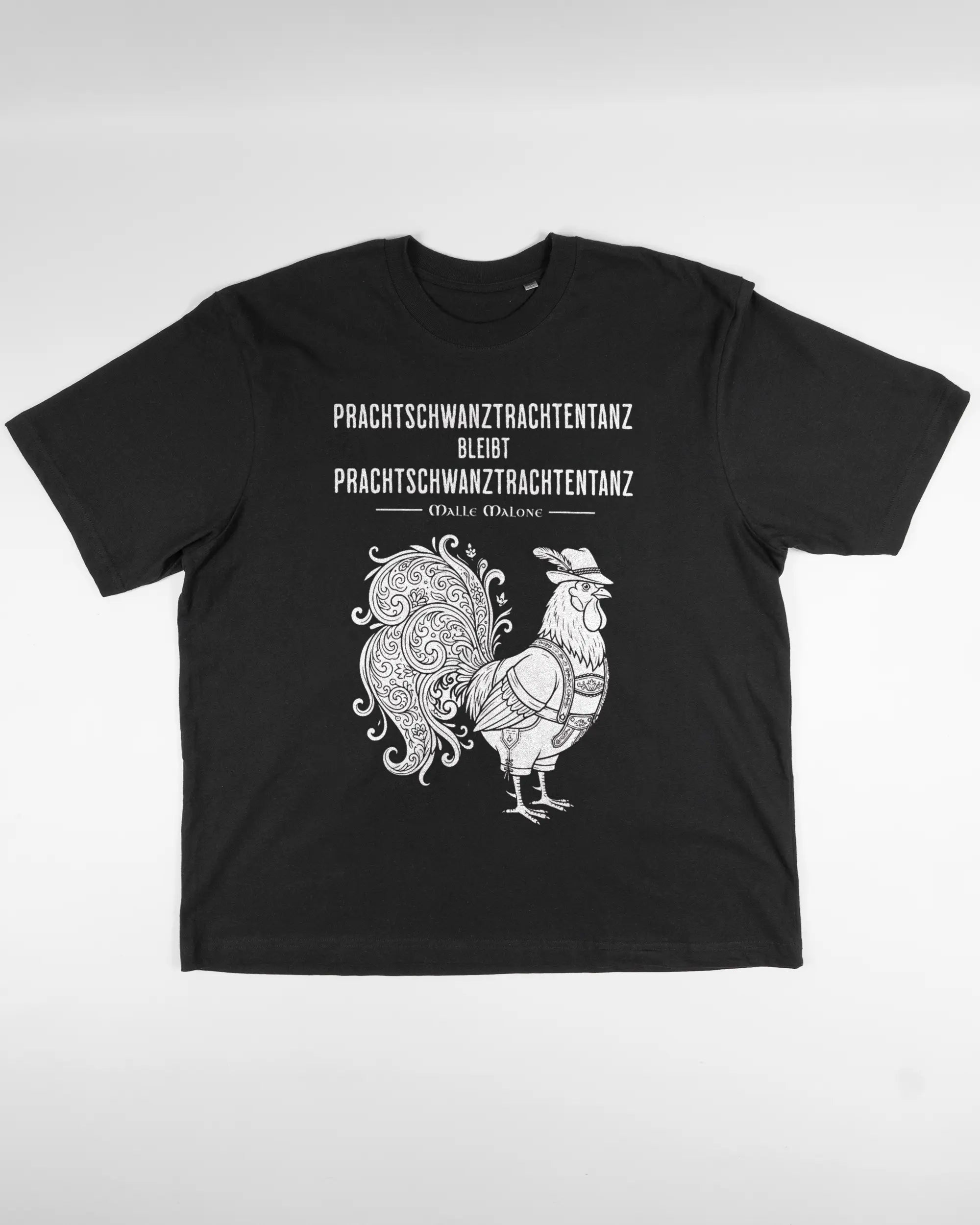 Vorderseite des Basic Unisex T-Shirt Oversized von Maondo mit dem Design Trachtentanz in der Farbe Black und in der Größe L flach auf den Boden gelegt