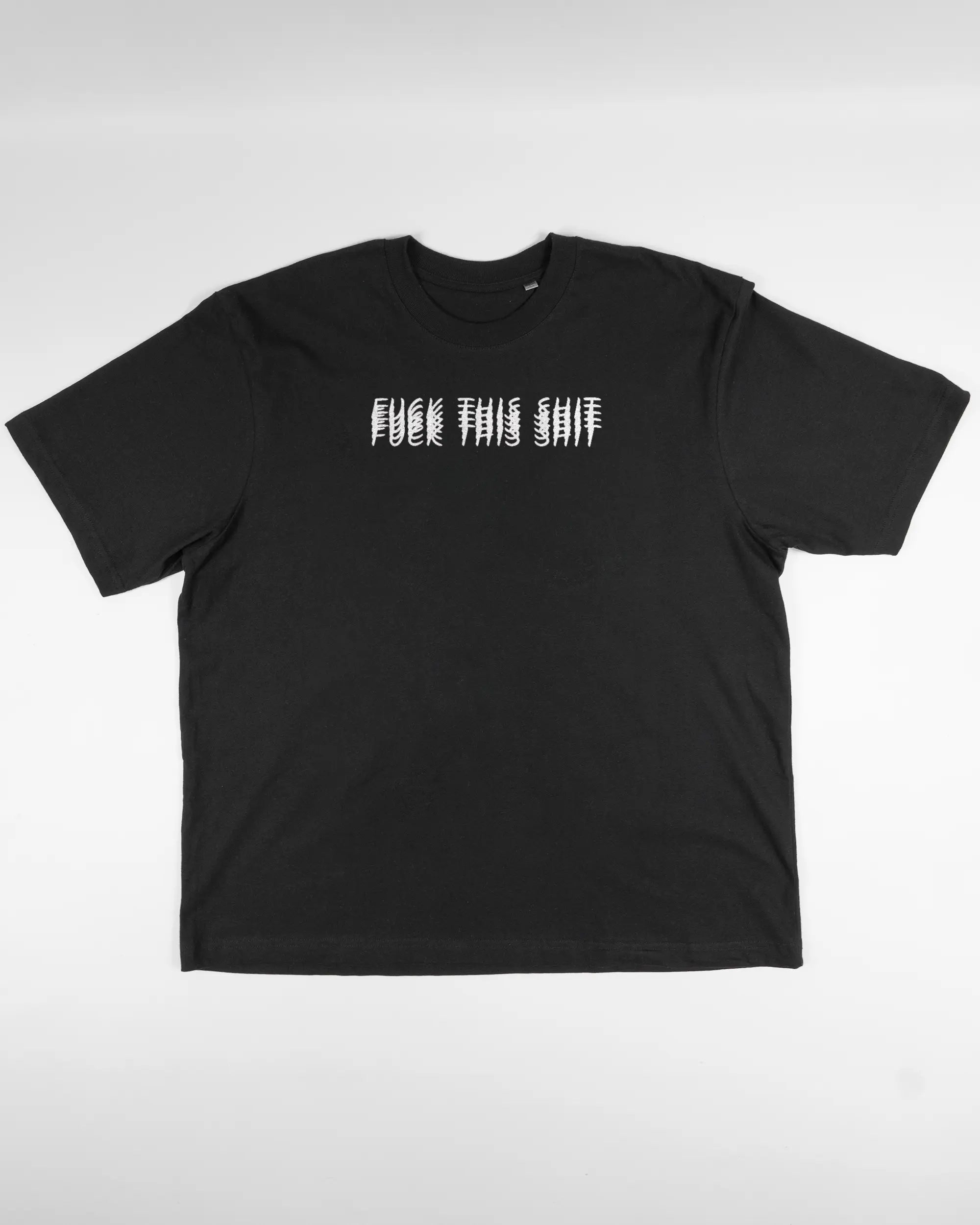 Vorderseite des Basic Unisex T-Shirt Oversized von Maondo mit dem Design Hidden Message in der Farbe Black und in der Größe L flach auf den Boden gelegt