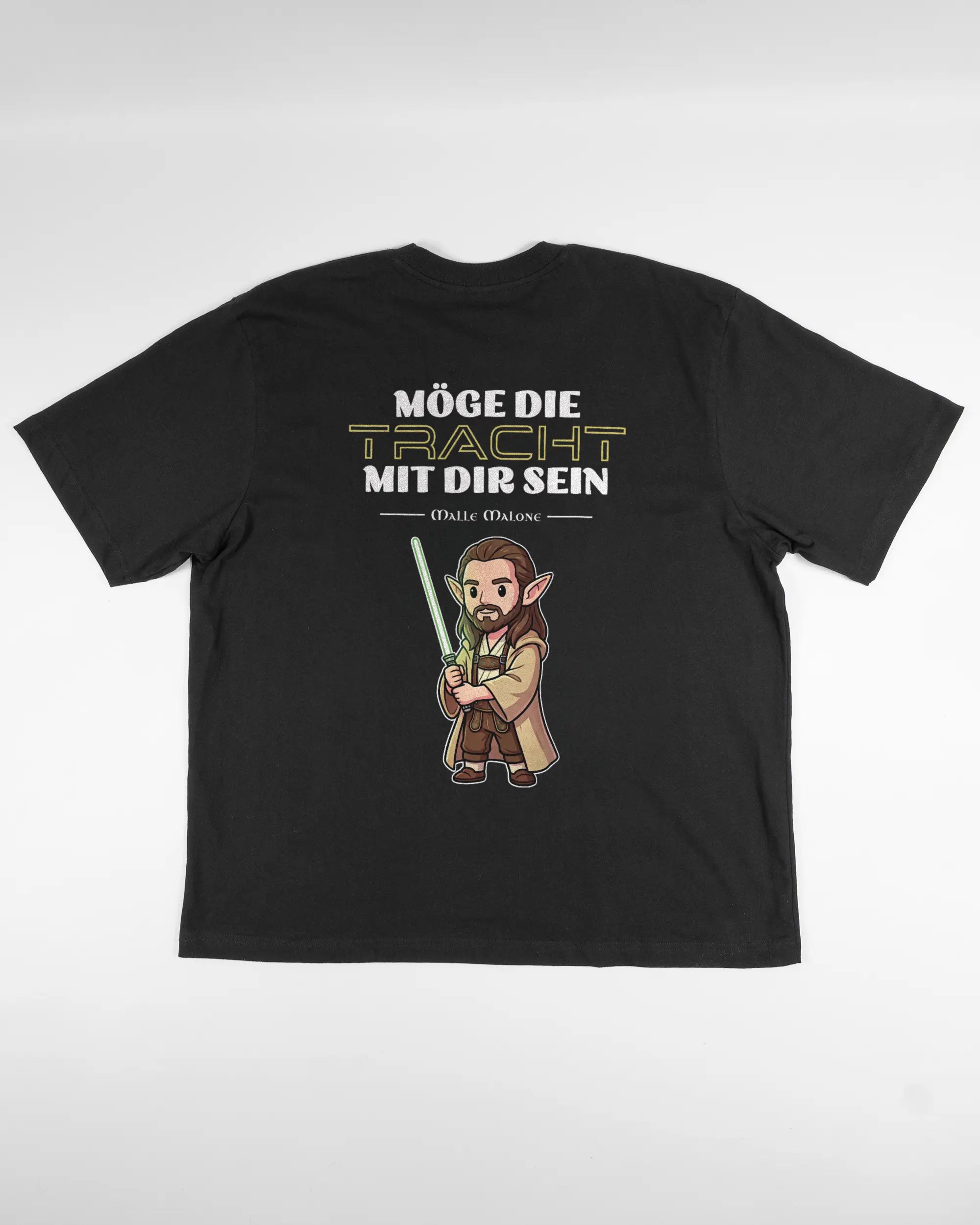 Rückseite des Basic Unisex T-Shirt Oversized von Maondo mit dem Design Tracht mit dir in der Farbe Black und in der Größe L flach auf den Boden gelegt