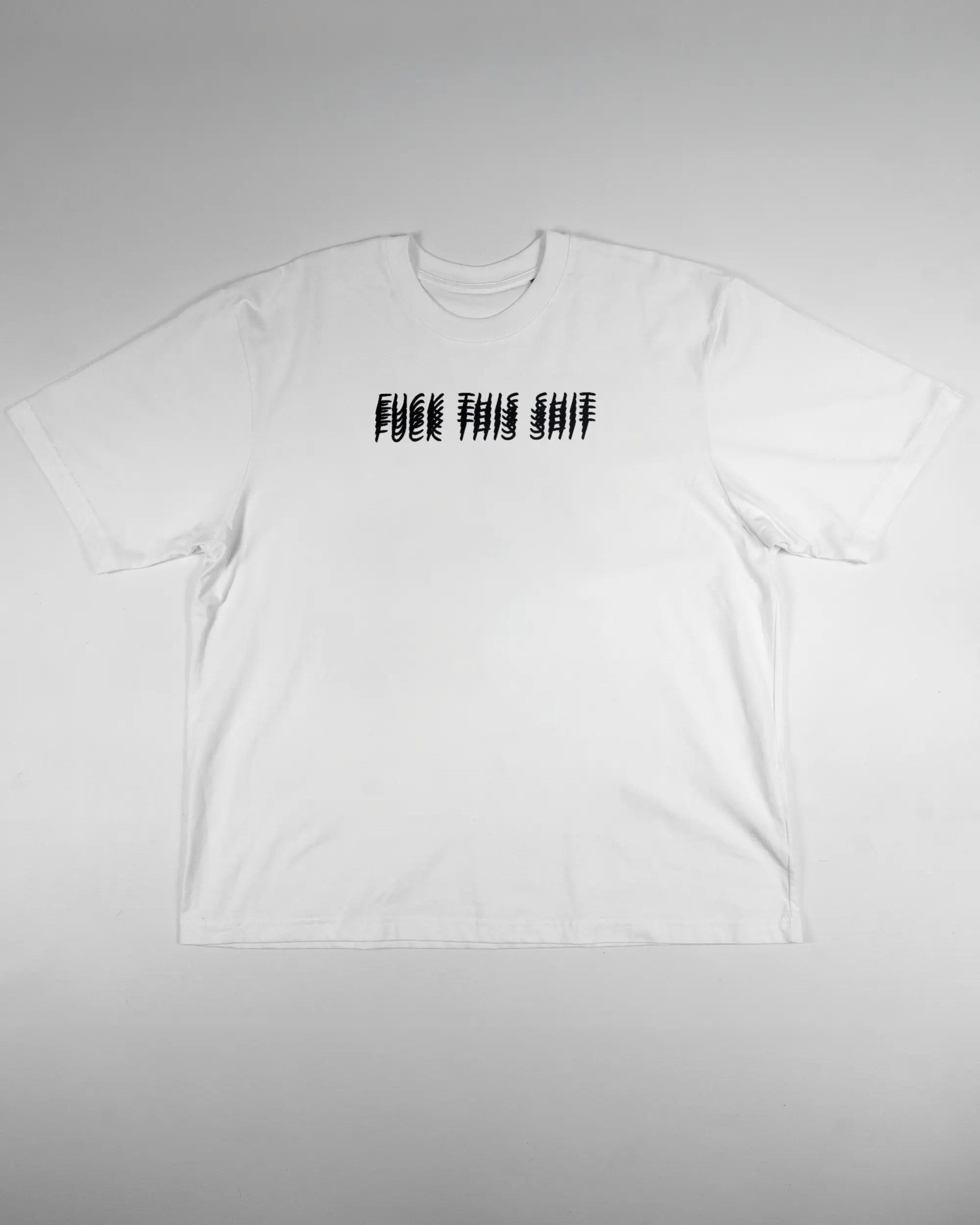 Vorderseite des Basic Unisex T-Shirt Oversized von Maondo mit dem Design Hidden Message in der Farbe White und in der Größe L flach auf den Boden gelegt