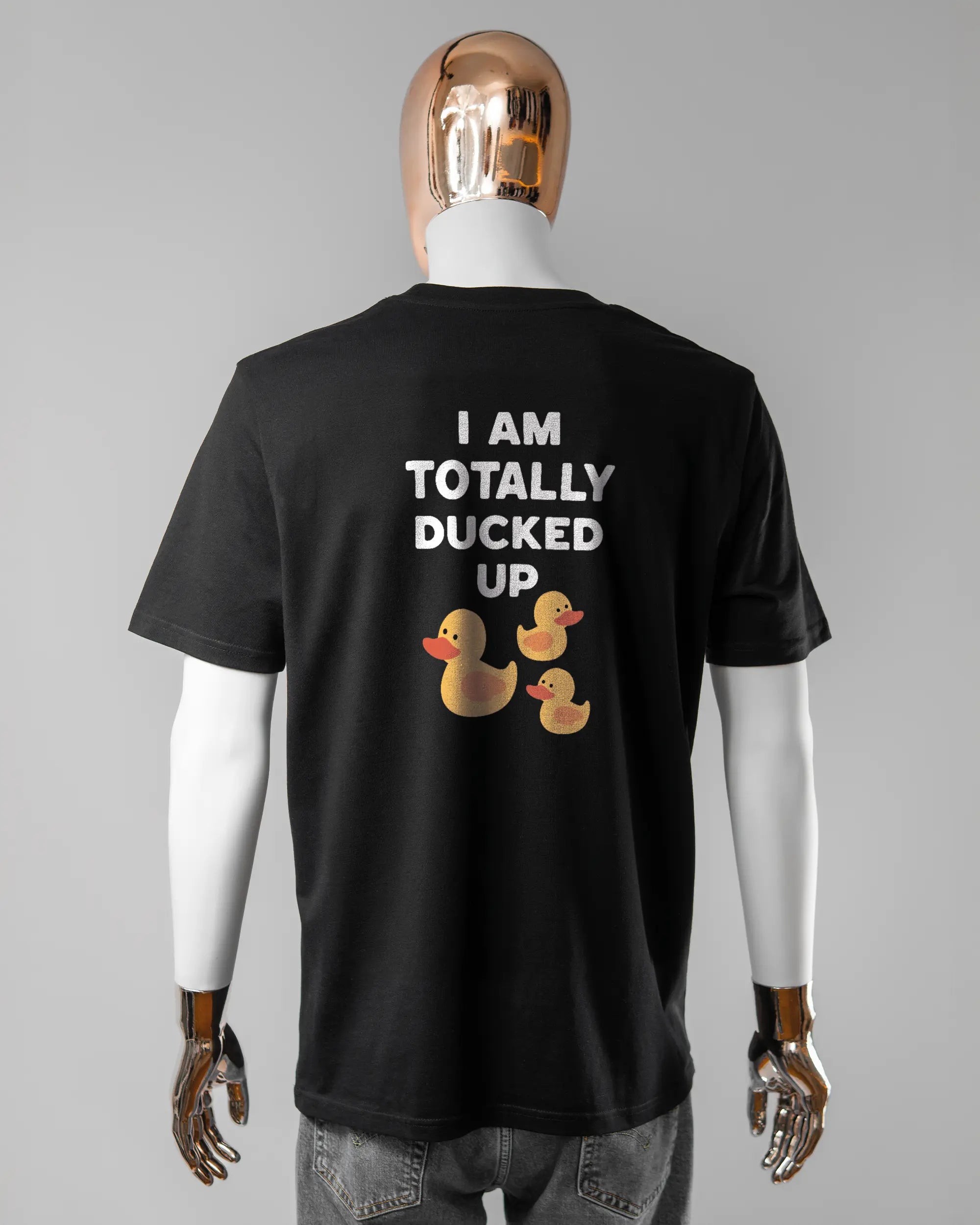 Rückseite des Organic Unisex T-Shirt Casual von Maondo mit dem Design Ducked Up in der Farbe Black und in der Größe L getragen von einer maskulinen Puppe