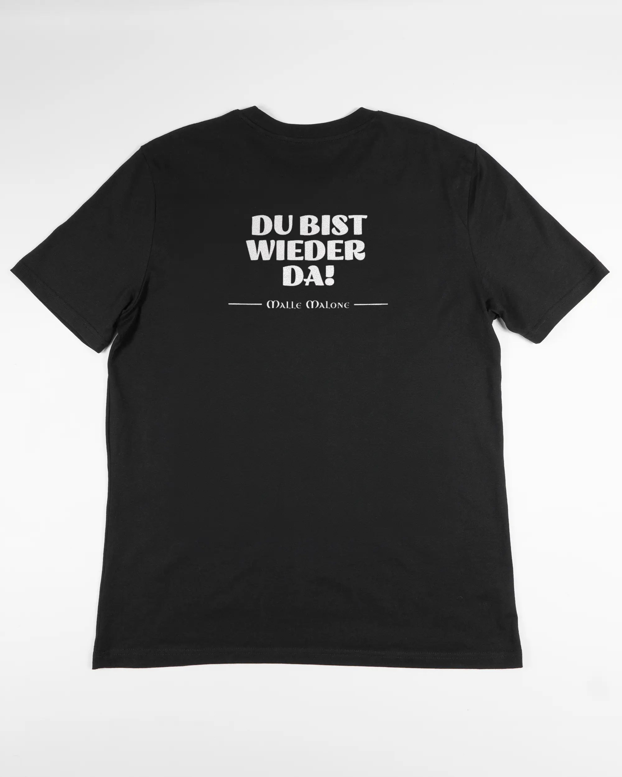 Rückseite des Organic Unisex T-Shirt Casual von Maondo mit dem Design Wieder da in der Farbe Black und in der Größe L flach auf den Boden gelegt