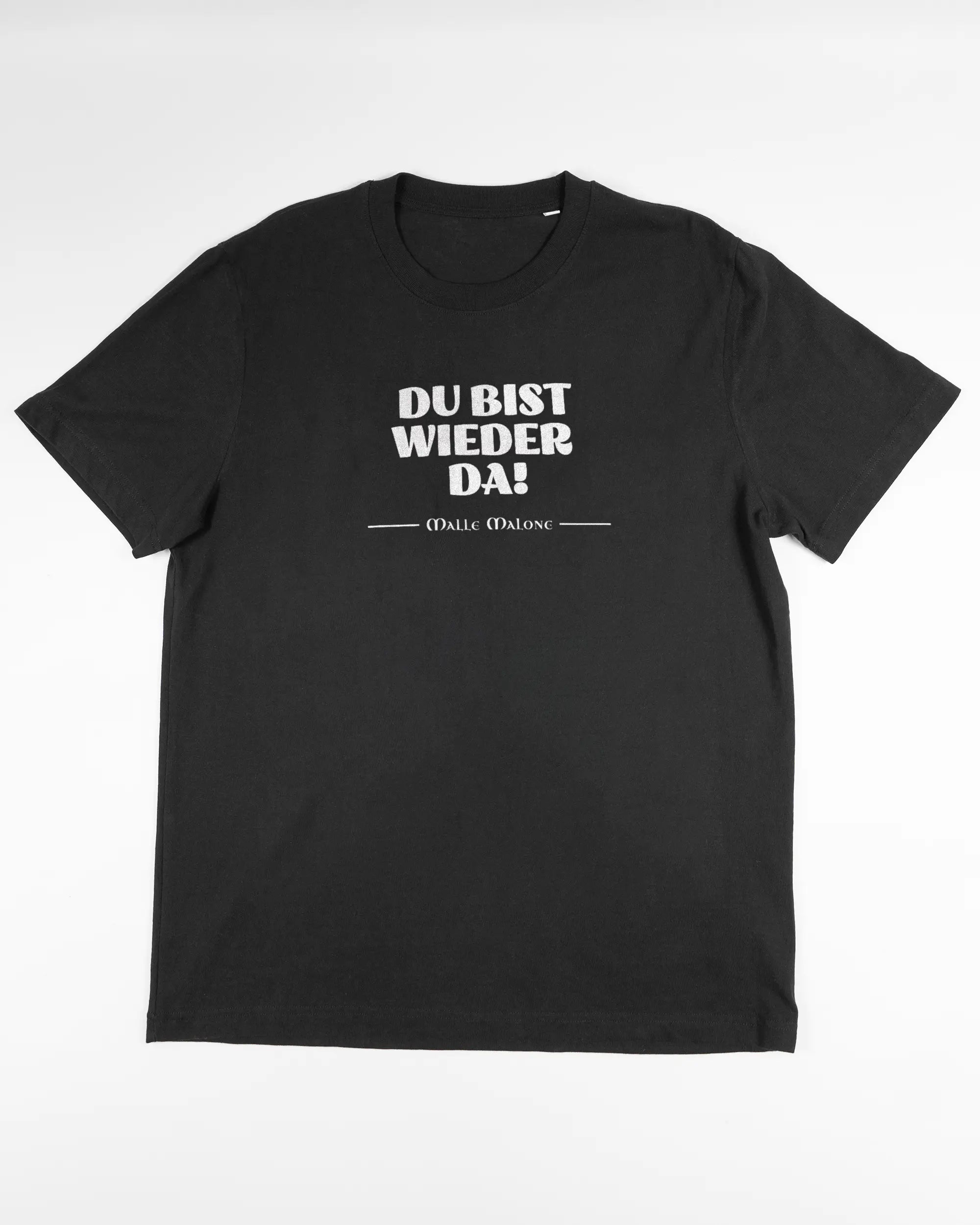 Vorderseite des Organic Unisex T-Shirt Relaxed von Maondo mit dem Design Wieder da in der Farbe Black und in der Größe L flach auf den Boden gelegt