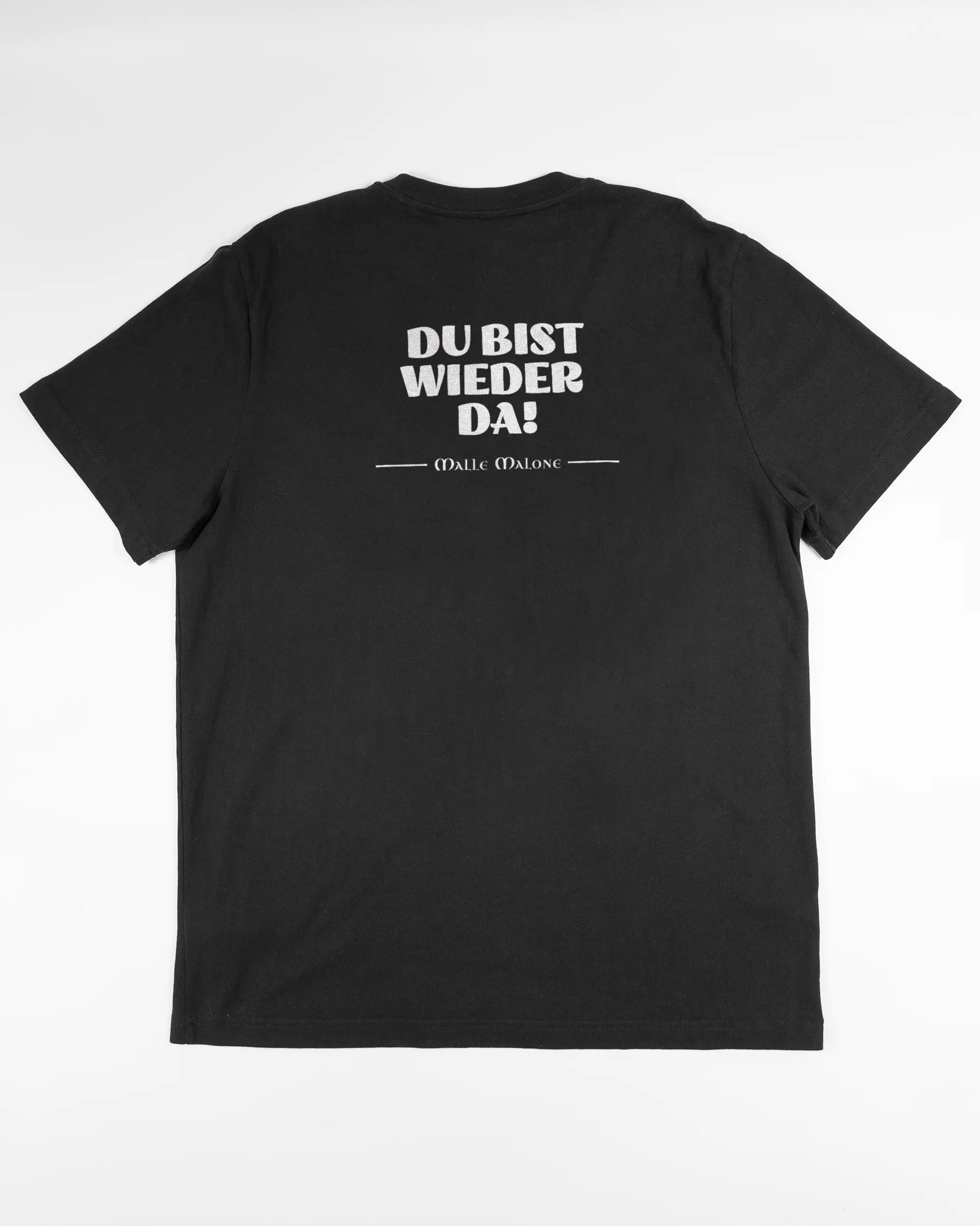 Rückseite des Organic Unisex T-Shirt Relaxed von Maondo mit dem Design Wieder da in der Farbe Black und in der Größe L flach auf den Boden gelegt