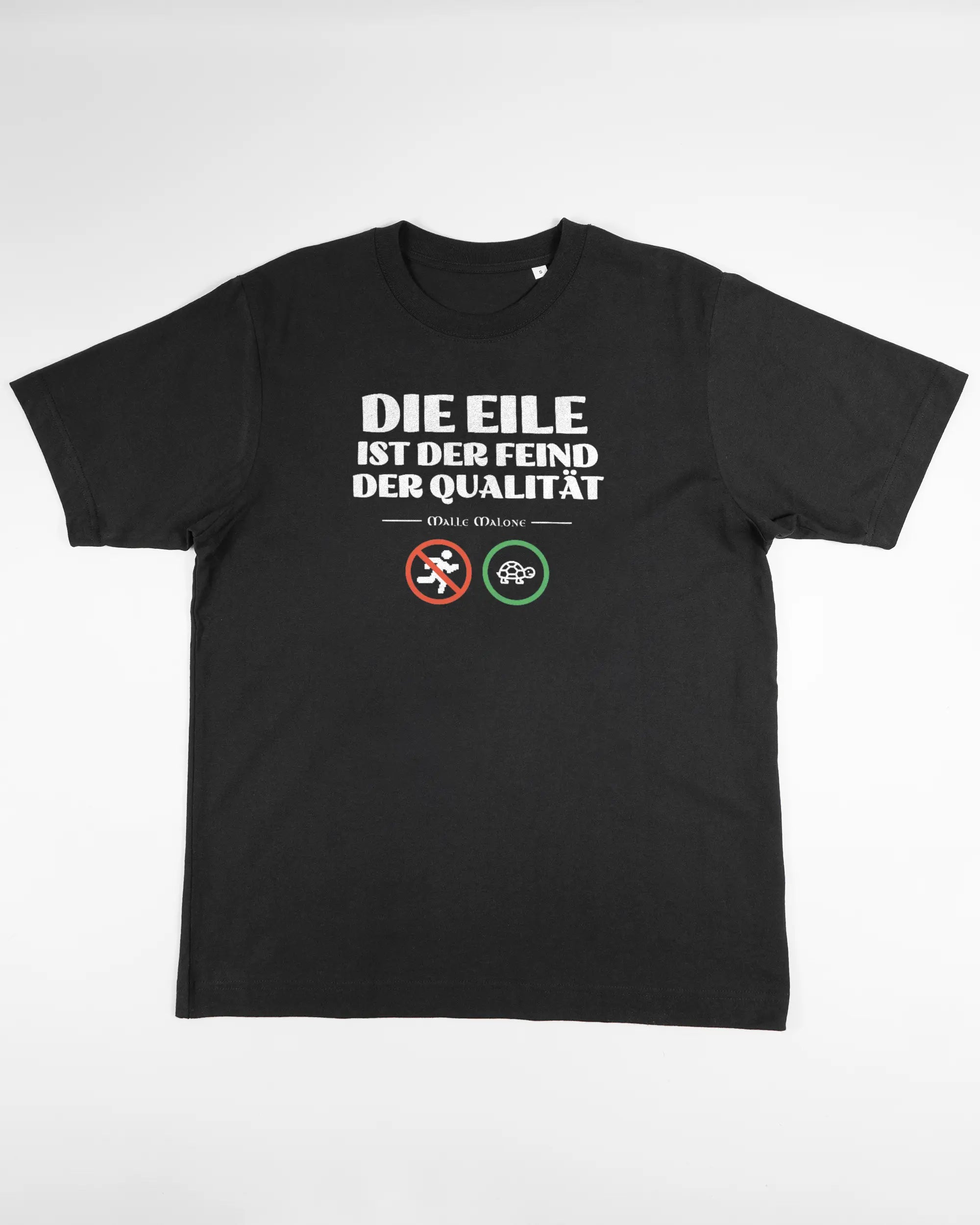Vorderseite des Organic Unisex T-Shirt Heavy Oversized von Maondo mit dem Design Keine Eile in der Farbe Black und in der Größe S flach auf den Boden gelegt