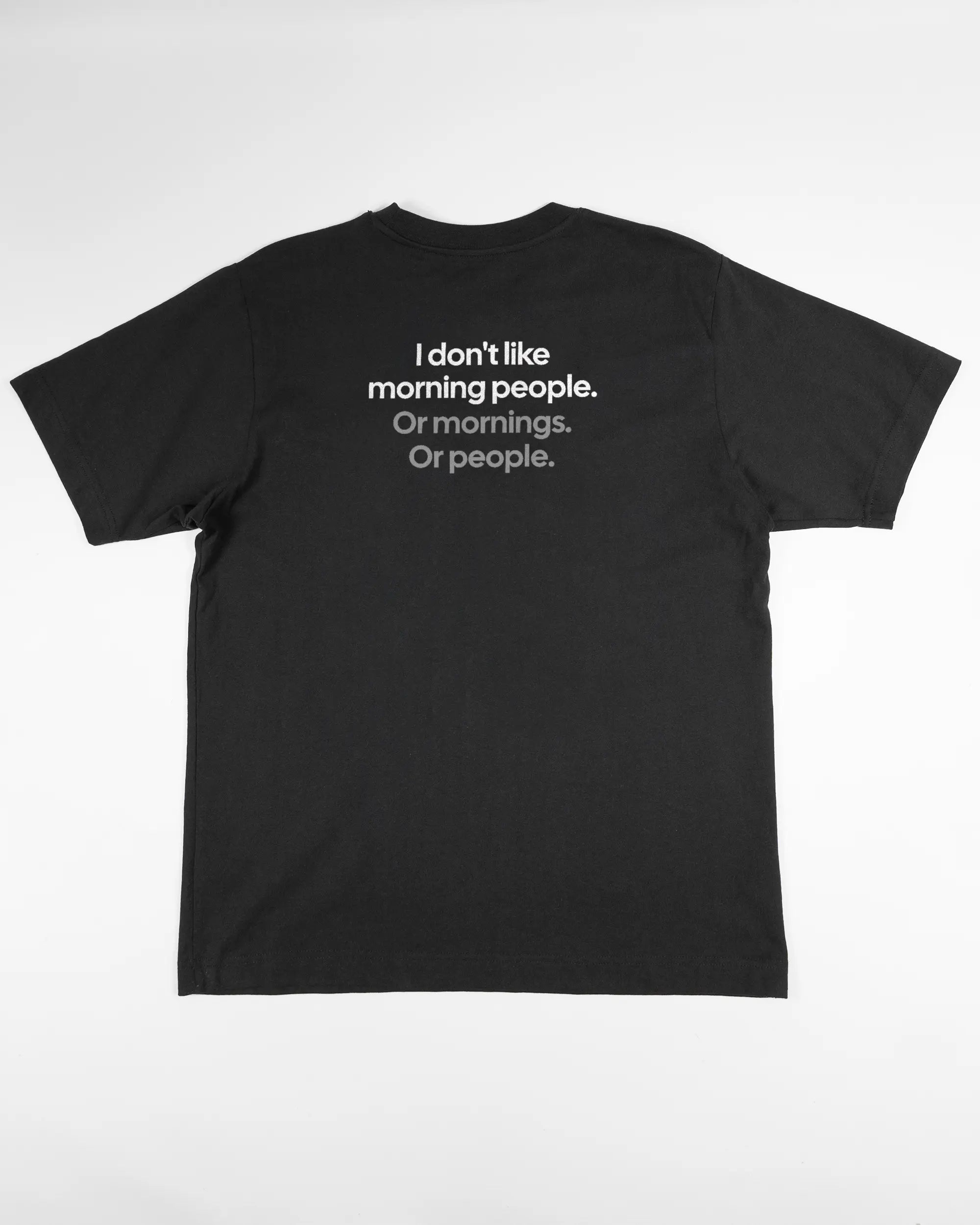 Rückseite des Organic Unisex T-Shirt Heavy Oversized von Maondo mit dem Design Morning Person in der Farbe Black und in der Größe S flach auf den Boden gelegt